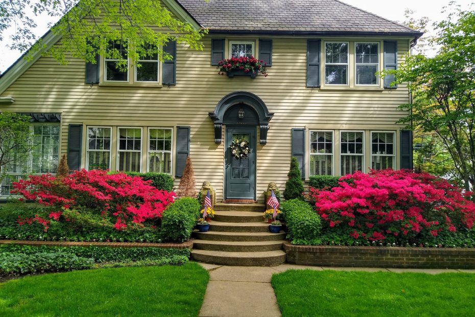 An image of a house with a lush lawn
