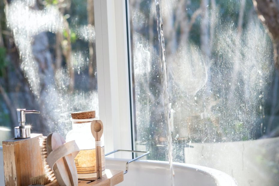 An image of a basin in a bathroom with an open tap
