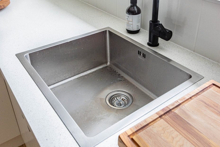 An image of a kitchen sink with a tap