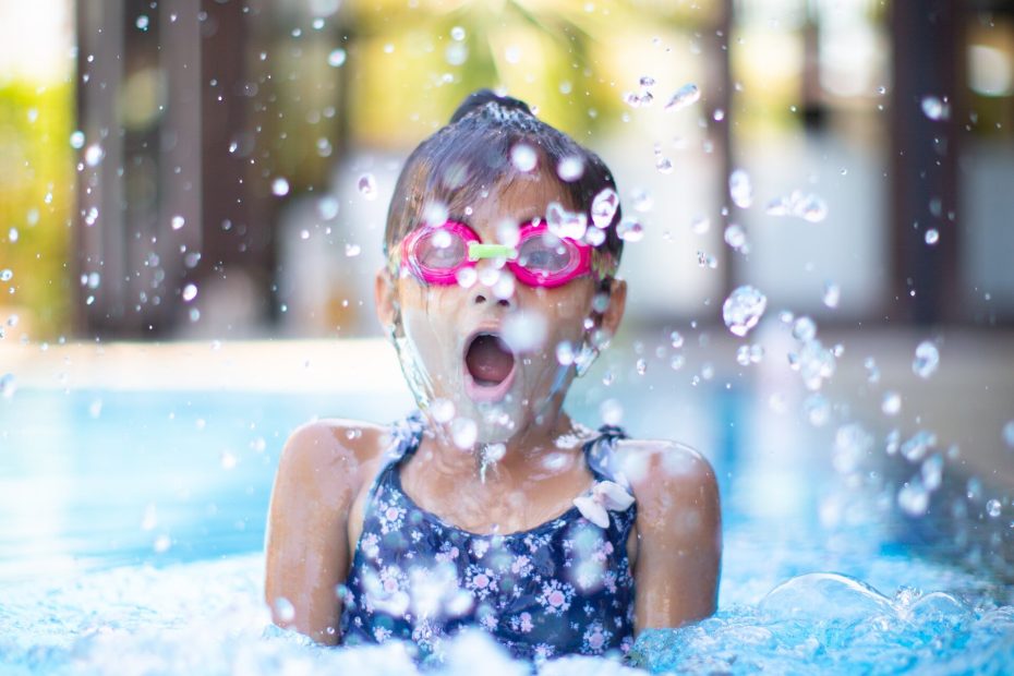 An image of a child splashing in a pool